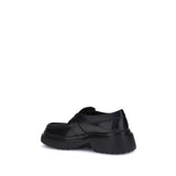 Tod's Black Rubber Platform Loafers
