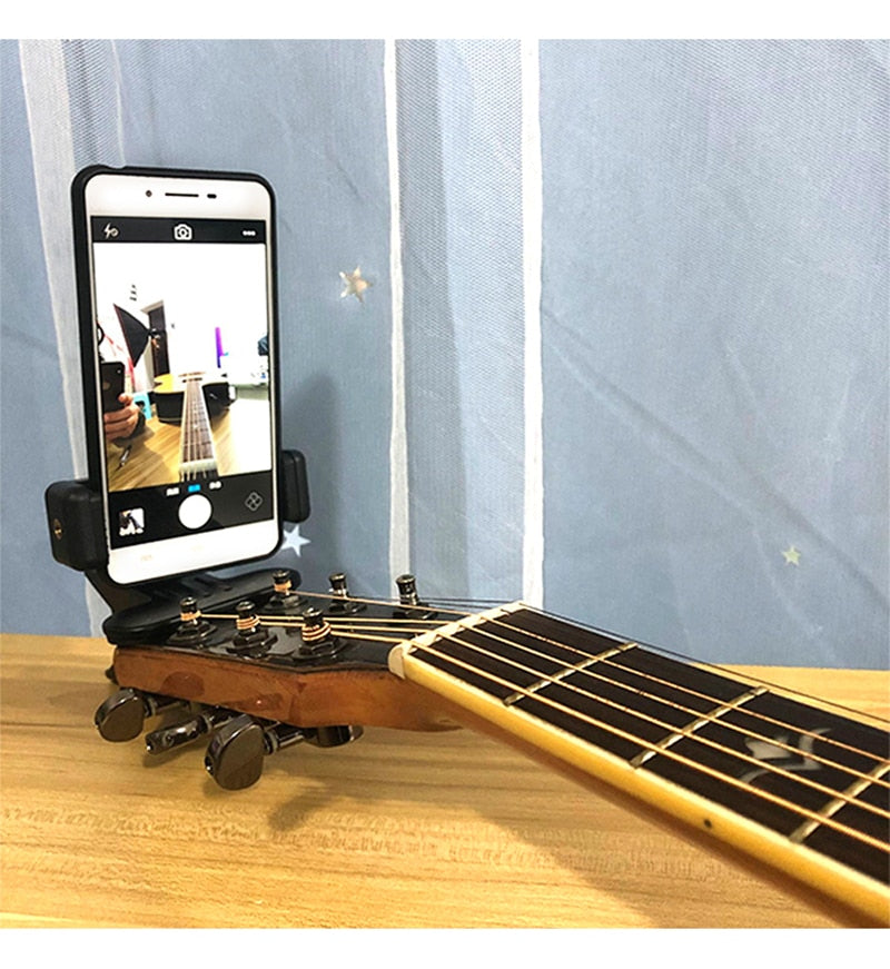 Clip pour téléphone portable tête de guitare