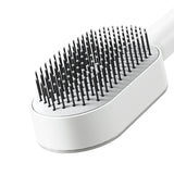 Brosse à cheveux antistatique autonettoyante